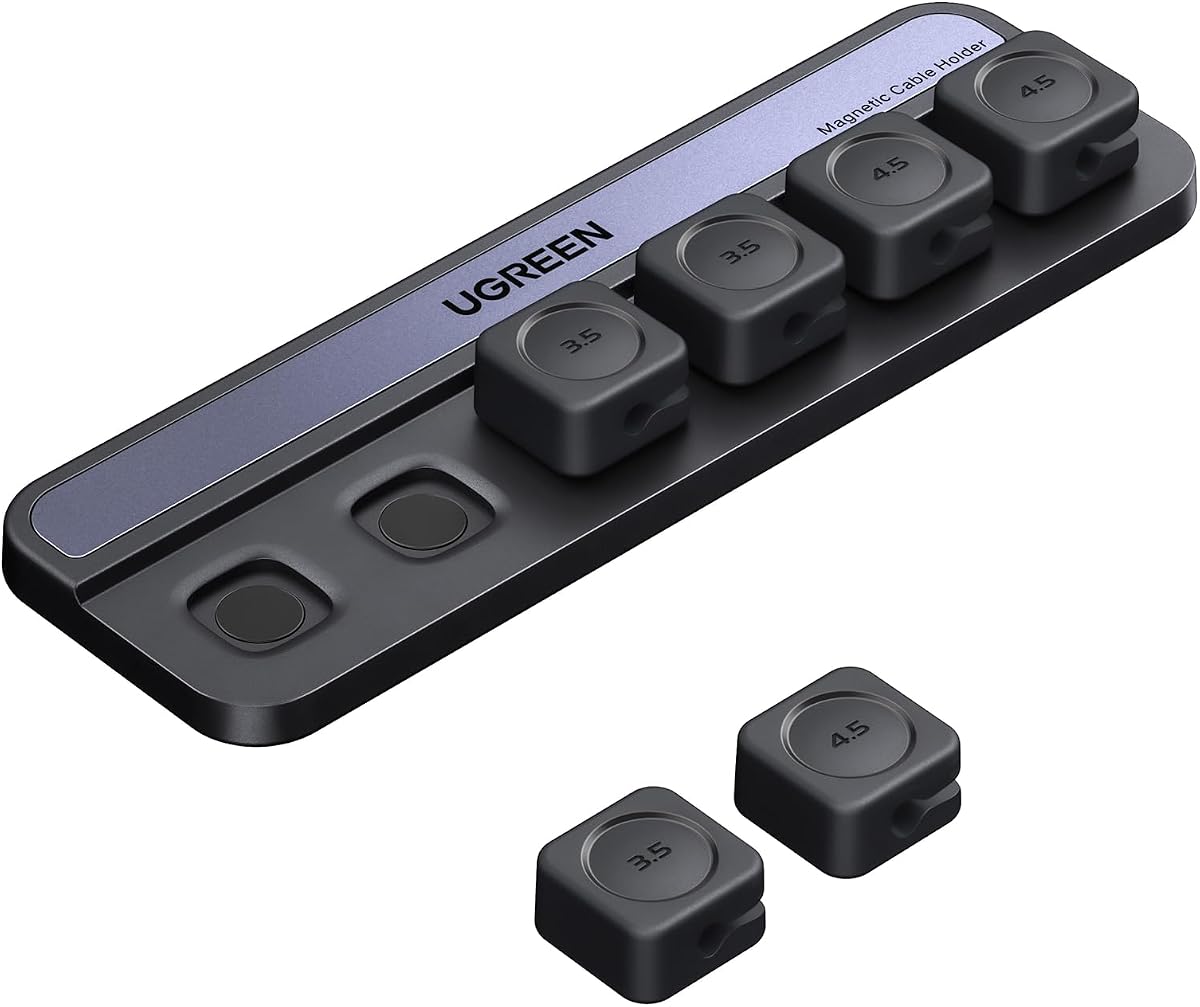 Magnetic cable holder and cord organizer keeping charging cables secured on a desk edge