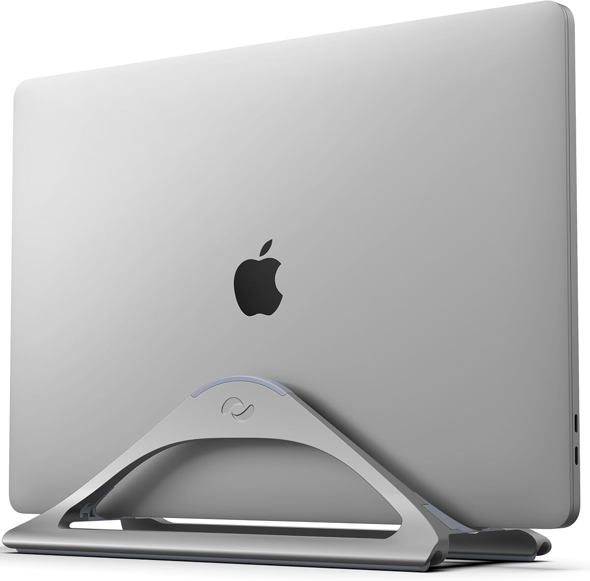 HumanCentric vertical laptop stand holding a closed laptop upright to save desk space
